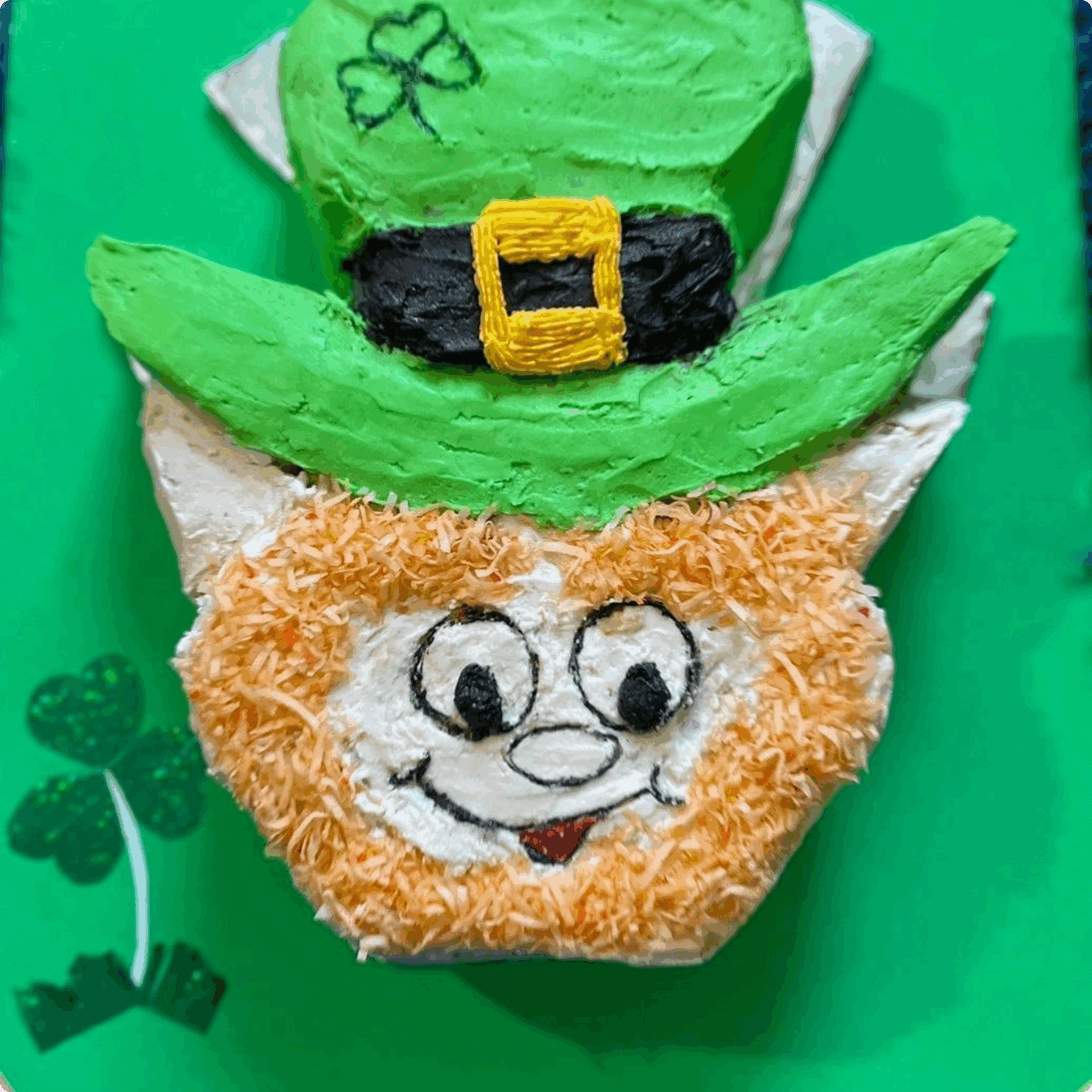 A festive leprechaun face cake with a green hat.